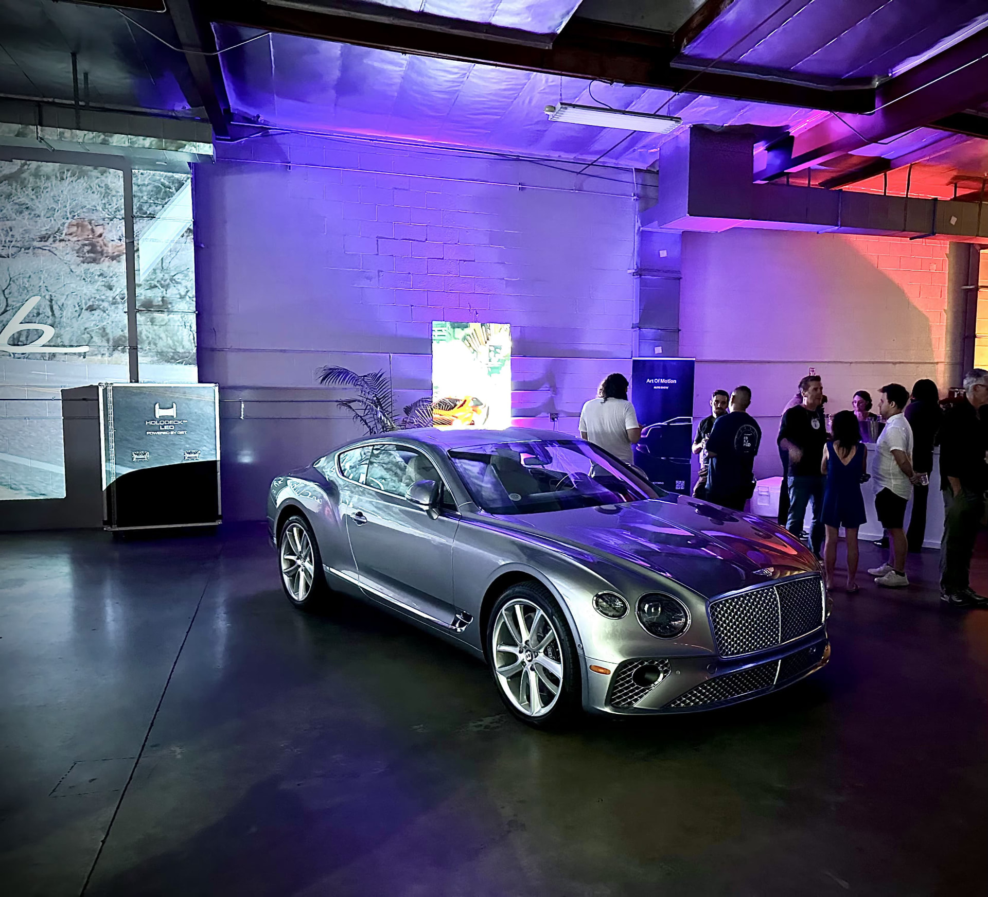 Bentley Continental GT on display as guests gather inside 3370 Livonia