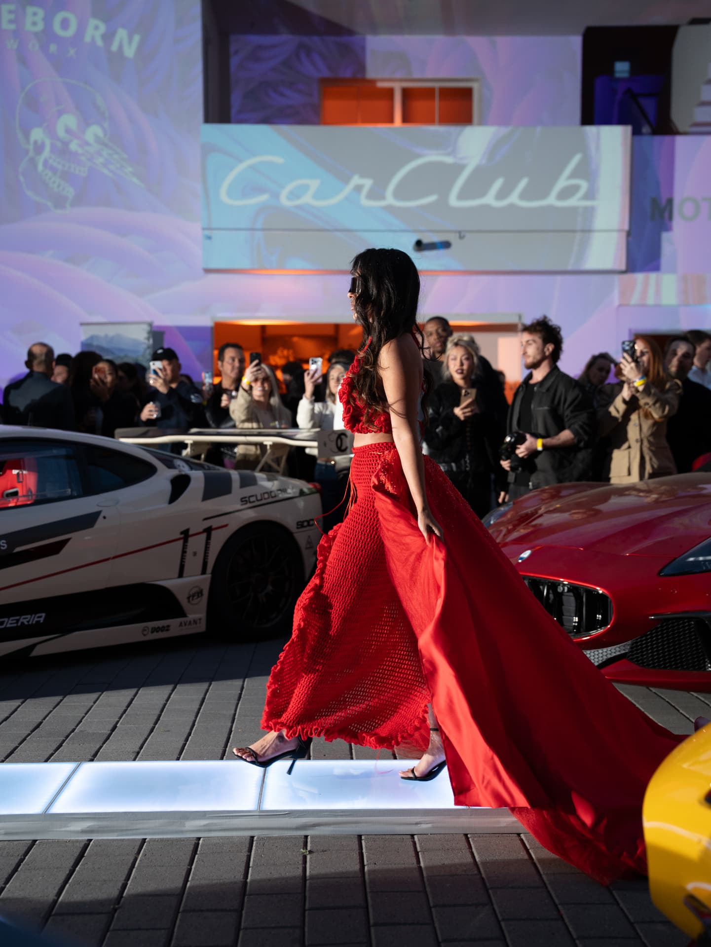 Runway walk between supercars at Cars & Capital